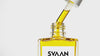 professional, cinematic product video for SVAAN – Golden Amara Hair Oil. This video shows product as ritualistic, premium, focusing on slow-motion macro shots, golden tones of the oil, and sensorial details. The dropper is opened and the golden yellow oil is dropped from it to the bottle.