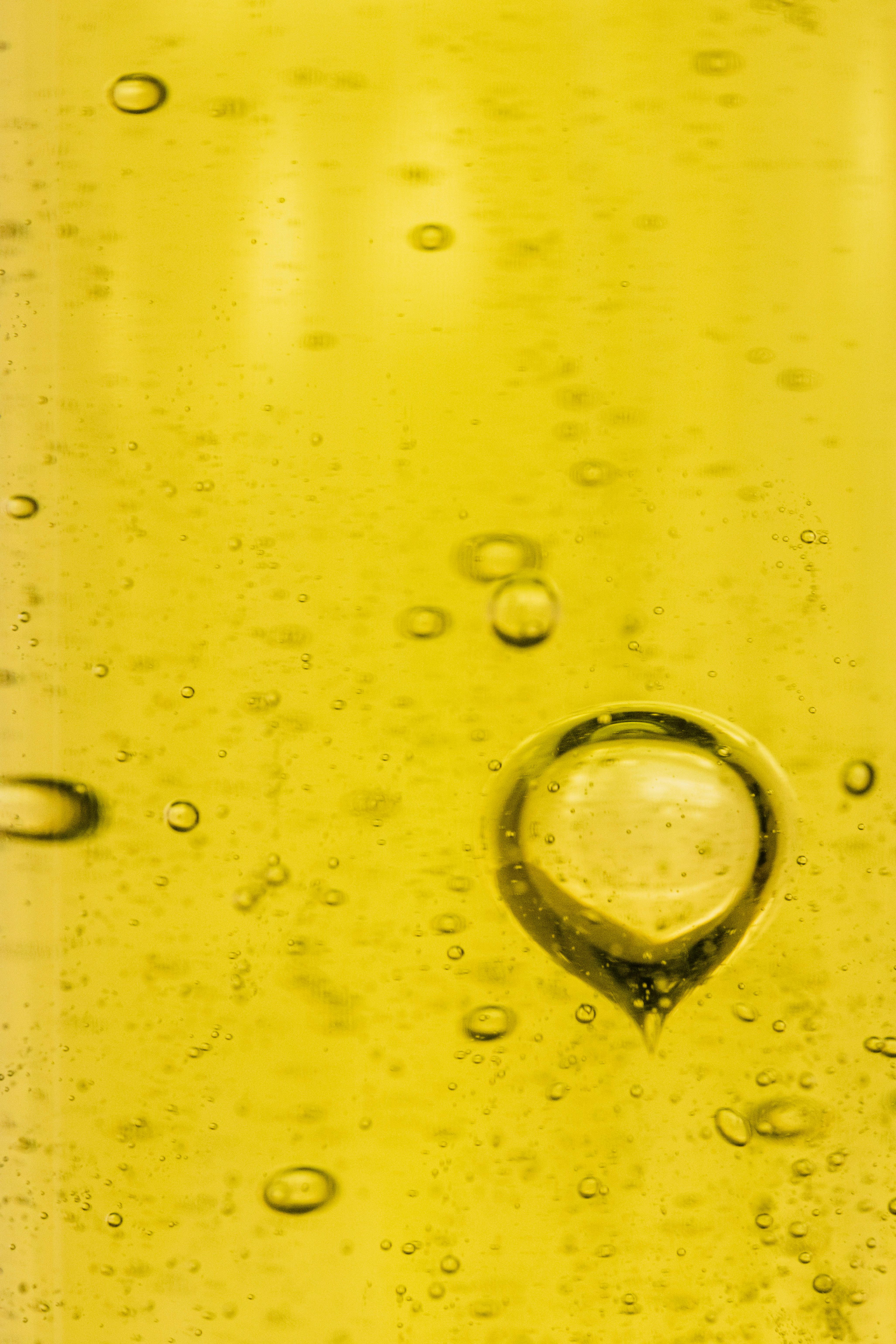 Close-up of yellow liquid with bubbles
